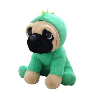 Cute pug plush toy wearing green dinosaur hoodie in sitting position on white background