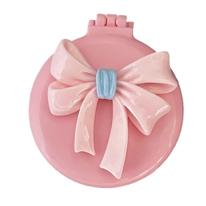 Pink round massage hairbrush with a 3D blue and pink bow on top for girls and kids