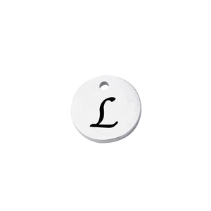 Macro shot of silver stainless steel round pendant featuring a black laser engraved letter L