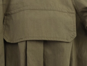 Detail of pocket flap and twill fabric texture on army green casual two-piece set