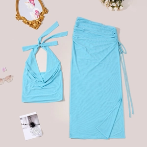 Flat lay of blue two-piece halter top and ruched skirt set with mesh texture