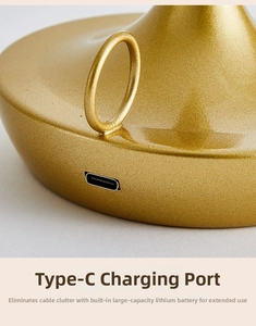Detail of golden table lamp base showing Type-C port and large capacity battery