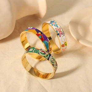 Three-piece set of colorful enamel stainless steel bangles with floral and geometric patterns