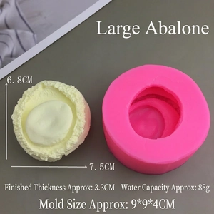 Macro view of a pink silicone mold showing detailed abalone textures for DIY baking