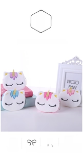 Detail showing four colorful plush unicorn coin purses with closed eye design and bead chains