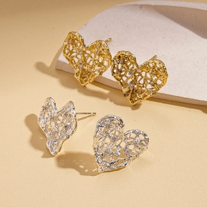 Minimalist hollow mesh heart stud earrings set with zircon in gold and silver finish