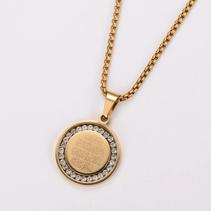 Detail of 18k gold plated round pendant with crystals and Arabic calligraphy engraving