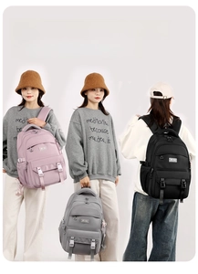 Detail view of large capacity waterproof backpack in pink, grey and black colors