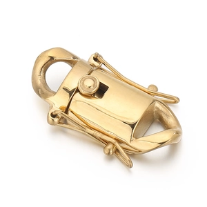 Detailed macro shot of golden stainless steel spring dragon clasp for jewelry DIY crafts