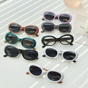 Detailed view of oval children's sunglasses collection featuring UV400 protection labels