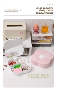 Pink clover petal makeup box with internal compartments and heart-shaped mirror details