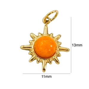 Detail view of a vintage starburst pendant with dimensions 11mm by 13mm in gold