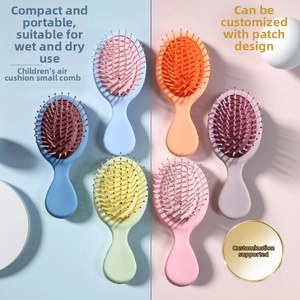 Macro shot of colorful mini portable hair brushes with soft air cushions for children