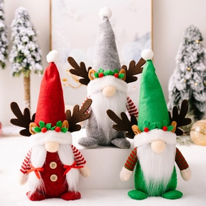Three Christmas gnomes with antlers and plush beards in red, grey, and green colors