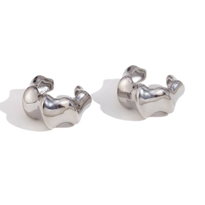Irregular silver textured hoop earrings in wave design with polished metal finish