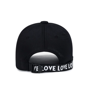 Back view of black baseball cap featuring adjustable long strap with white LOVE print