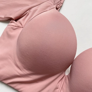 Pink push-up bra with smooth seamless fabric texture shown from a side profile view