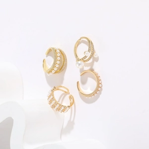 Detail of 14K gold plated ear cuff set with white pearls and sparkling cubic zirconia