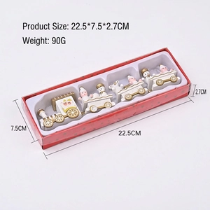 White and gold wooden Christmas train set with four sections in a gift box packaging