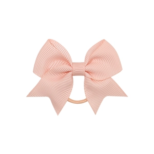 Detailed view of pink ribbed grosgrain ribbon texture on high-elasticity hair bow tie