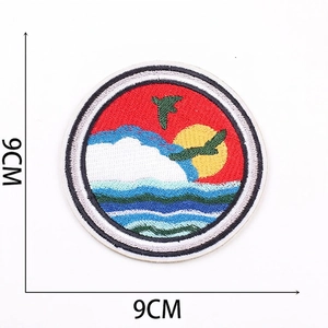 Detailed view of 9cm round embroidered patch with sun and waves design including 5.5g weight