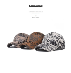 Three cotton baseball caps featuring various leopard and animal print patterns displayed