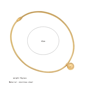 Detailed view of 43cm gold stainless steel choker with spherical spring pendant
