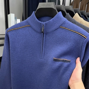 Detail of blue men's quarter-zip sweater with high collar and stripe texture design