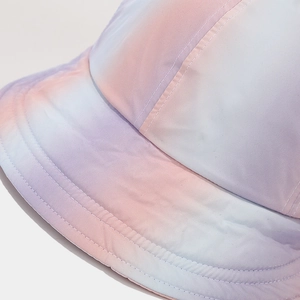 Detail of macaron gradient sun hat featuring reinforced parallel stitching on the brim
