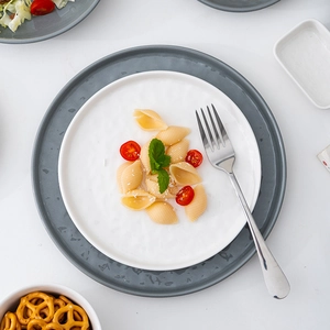 French style white and grey-blue ceramic plates and bowls with silver metal fork
