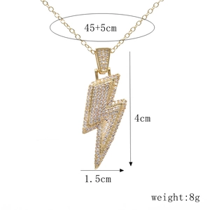 Detail view of gold lightning bolt pendant with size specs: 4cm height and 8g weight