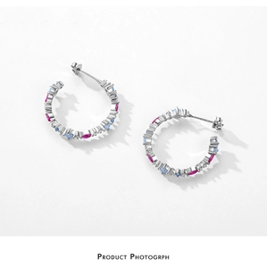 Detailed macro view of S925 silver C-shape earrings with colorful heart and marquise stones