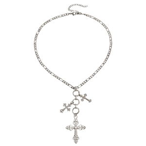 Detailed view of silver alloy cross pendants with sparkling rhinestones on Figaro chain