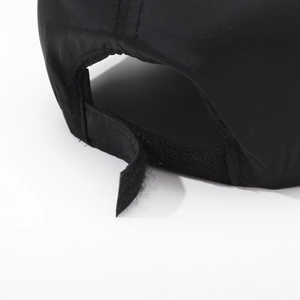 Rear view of black long brim sun hat with adjustable Velcro strap and reflective strip