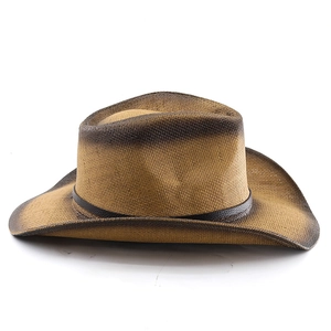 Detail of tan woven cowboy hat with gradient edges and dark brown faux leather band
