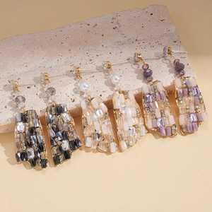 Bohemian geometric drop earrings with gold metal and multi-colored resin stones