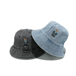 Washed denim bucket hats with embroidered bears in dark gray and light blue colors