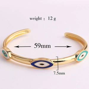 Detailed view of enamel evil eye cuff bracelet with 12g weight and 59mm diameter specs