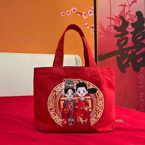 Red canvas wedding gift bag featuring traditional Chinese bride and groom illustrations