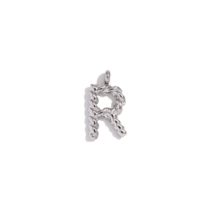 Close-up of a silver stainless steel letter R pendant with twisted rope texture
