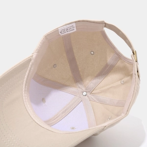 Detailed view of 100% cotton baseball cap interior with stitching and metal hardware