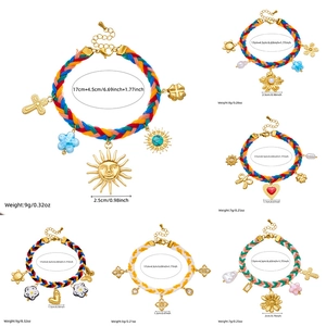Set of woven rope bracelets with gold plated charms including daisy, heart, and sun icons