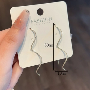 Elegant gold wavy tassel drop earrings with delicate spiral texture shown at 50mm length