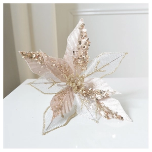 Detailed view of champagne gold Christmas flower with glitter mesh and layered petals