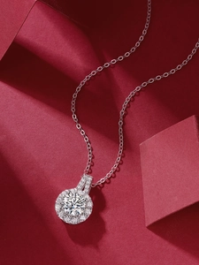 Detailed close-up of a 1ct moissanite halo necklace on a 925 sterling silver chain