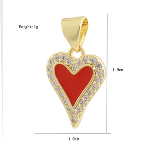 Detailed view of heart pendant with red enamel, zircons, and dimensions 1.9x1.0cm