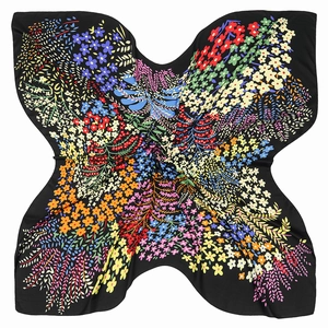 Detail of floral pattern on black twill silk scarf with vibrant colorful flower print