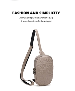 Detail of star-quilted cross-body chest bag in khaki grey PU leather with adjustable strap