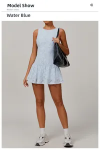 Close-up of wave blue lace sleeveless dress featuring a ruffled hem and mesh texture