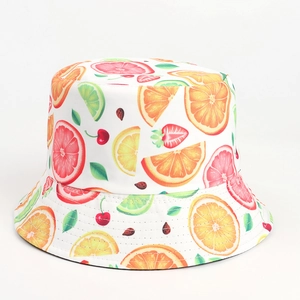 Detailed top view of a white bucket hat with colorful summer tropical fruit prints